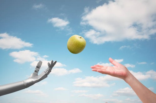 artificial intelligence passes a green apple to a girl - food stock pictures, royalty-free photos & images