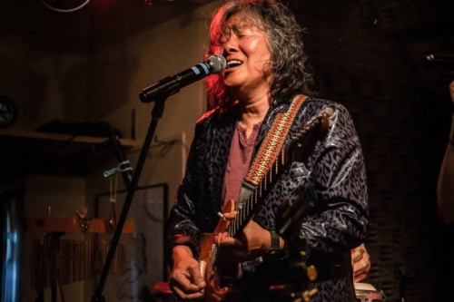 asean senior man performs hot live stage with electric guitar and vocal - concert stock pictures, royalty-free photos & images