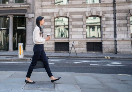 asian business woman walking on the street drinking a cup of coffee - junk food stock pictures, royalty-free photos & images