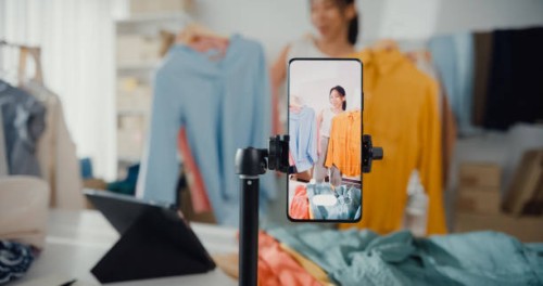 asian businesswoman live-streamed ecommerce sell clothes at home, beautiful girl using the smartphone and tablet for recording video. - fashion stock pictures, royalty-free photos & images