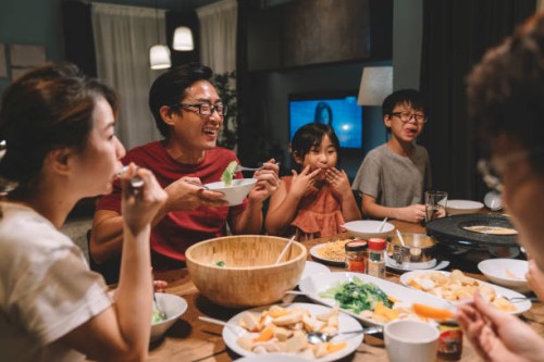 asian chinese family and cousins having reunion dinner at home - food stock pictures, royalty-free photos & images
