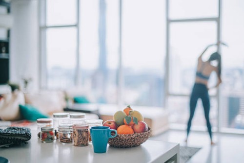 asian chinese female home workout in domestic living room facing the city - food stock pictures, royalty-free photos & images