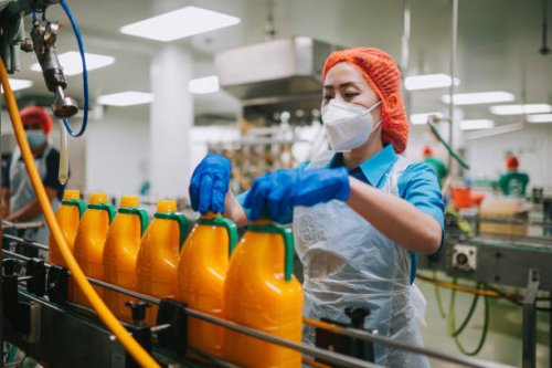 asian chinese female juice factory worker tighten bottle cap in production line - food stock pictures, royalty-free photos & images