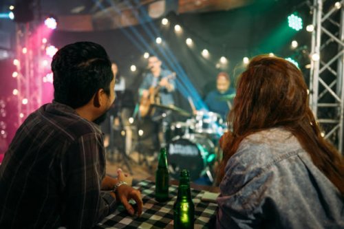 asian couple celebrating at party. - concert stock pictures, royalty-free photos & images
