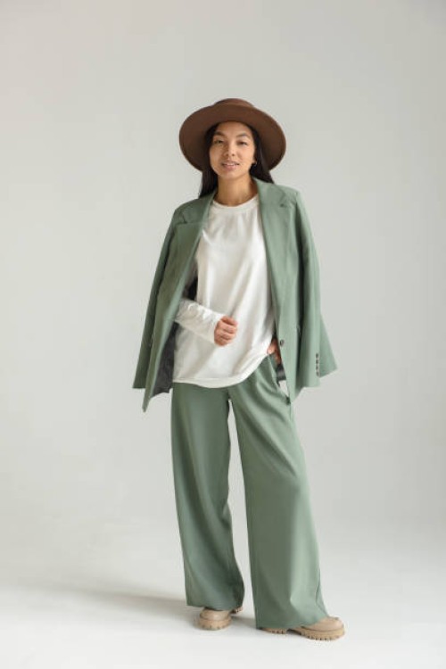 asian fashionable woman model posing in a beautiful outfit and hat on a white background on a cyclorama. - fashion stock pictures, royalty-free photos & images