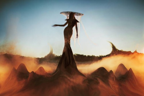 asian gothic woman in hat against backdrop of smoke and blue sky. fashion. witch. halloween look - fashion stock pictures, royalty-free photos & images