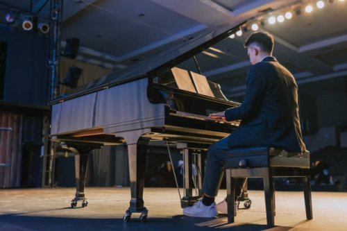 asian talented chinese pianist performing on stage - concert stock pictures, royalty-free photos & images