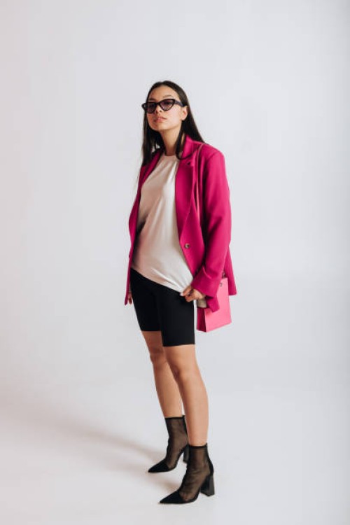 asian woman posing in studio in new clothes collection on white background - fashion stock pictures, royalty-free photos & images