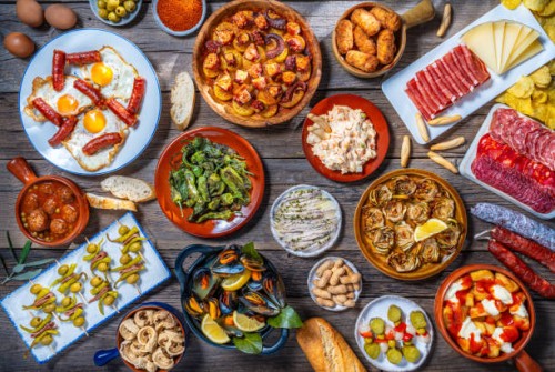 assorted tapas from spain food, typical spanish recipes, and pintxos on a rustic wood - food stock pictures, royalty-free photos & images