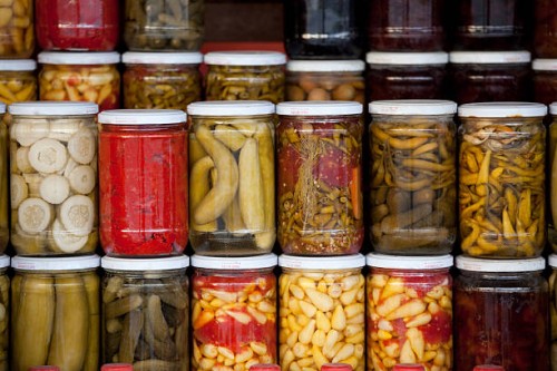 assortment of glass jars filled with pickled vegetables - food stock pictures, royalty-free photos & images