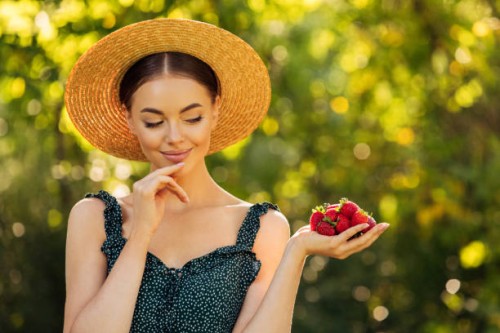 attractive girl with strawberries - food stock pictures, royalty-free photos & images