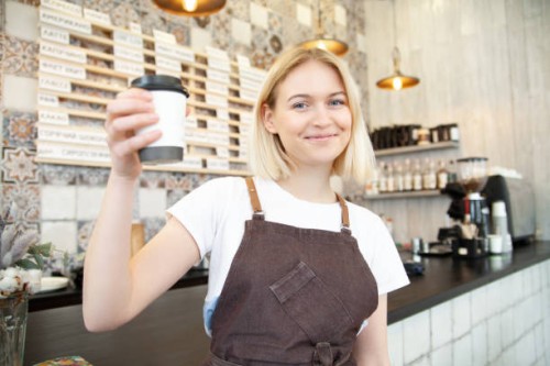 attractive smiling bartender making beverage in coffee shop - junk food stock pictures, royalty-free photos & images
