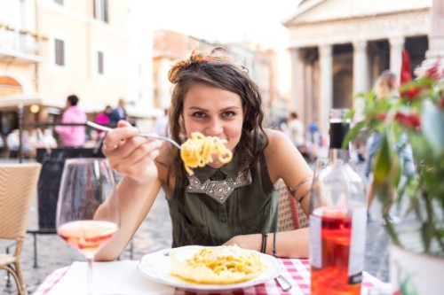 attractive young woman having meal in rome - food stock pictures, royalty-free photos & images