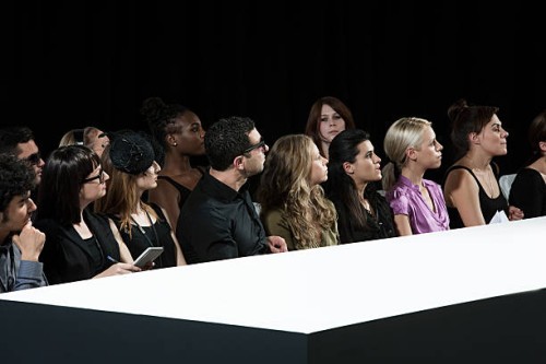 audience at fashion show watching empty catwalk - fashion stock pictures, royalty-free photos & images