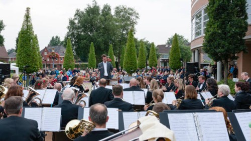 audience listening to a free outdoor concert of the local orchestra - concert stock pictures, royalty-free photos & images