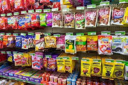 Australia, Victoria Melbourne Carlton Parkville University of Melbourne campus school Union House convenience store food shelves sale junk candy.