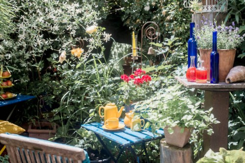 austria,salzburgerland,altenmarktimpongau,bottles andtea set on garden table - garden decoration photos et images de collection