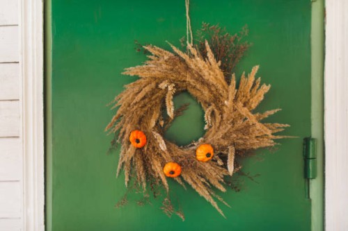 autumn wreath with small pumpkins hanging on green door. - garden decoration stock pictures, royalty-free photos & images
