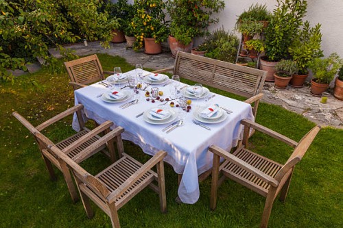 autumnal laid table in garden - garden decoration stock pictures, royalty-free photos & images