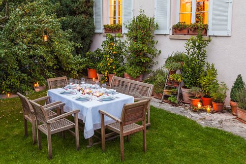 autumnal laid table in garden in the evening - garden decoration stock pictures, royalty-free photos & images