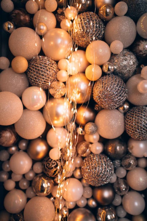 background made with abundance of christmas balls, festive toys and baubles. christmas lights, garland and illumination. concept of christmas or new year party celebration. - home decoration stock pictures, royalty-free photo