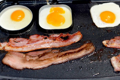 bacon and eggs on griddle - junk food stock pictures, royalty-free photos & images