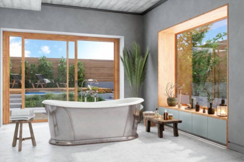 badezimmer mit badewanne, holzhocker und topfpflanze. gartenblick aus dem fenster. - garden decoration stock-fotos und bilder