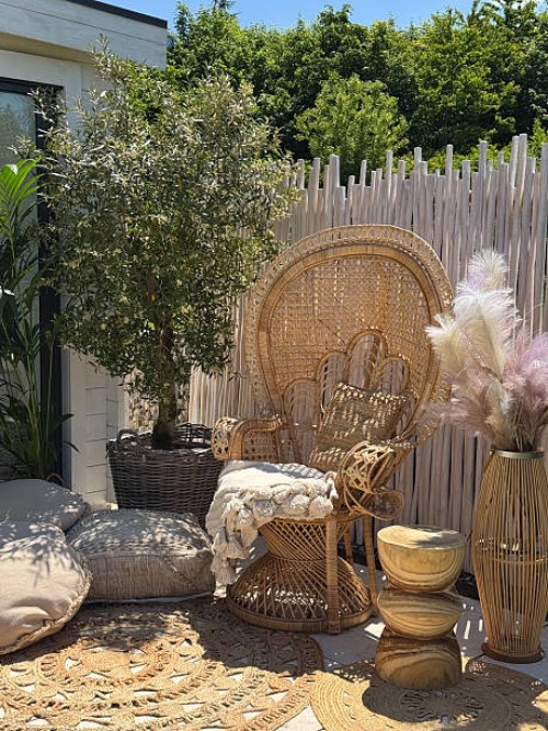 bali style peacock chair garden outdoor lounge in boho bamboo style with natural material and linen - garden decoration stock pictures, royalty-free photos & images