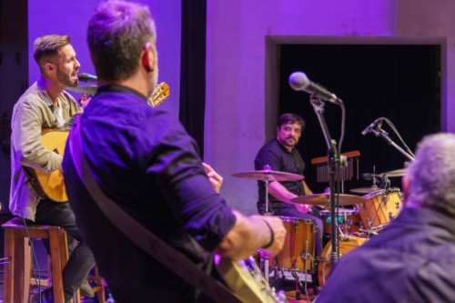 band of four musicians and singer playing on stage - concert stock pictures, royalty-free photos & images