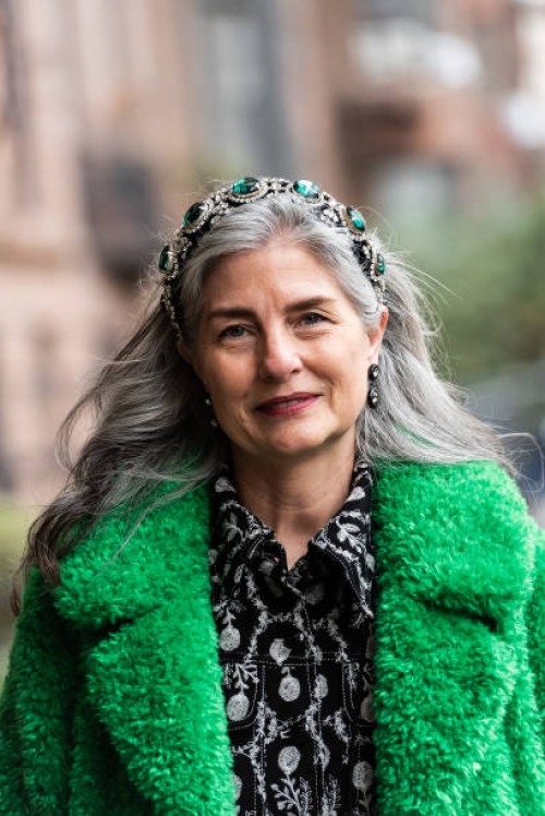 Barbara Paris Guilford wears Anna Sui green fluffy coat and black and grey shirt dress outside Anna Sui during February 2025 New York Fashion Week on...