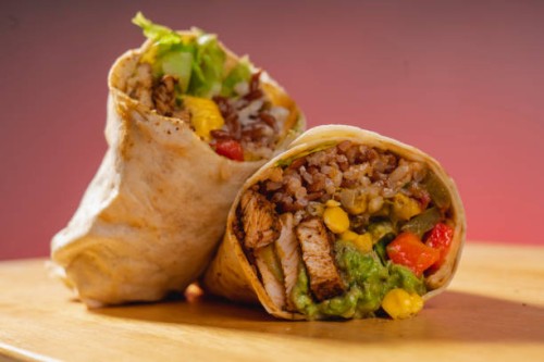 barbecue chicken, corn and guacamole tortilla wraps on a wooden base. vegetable burrito. healthy food. - junk food stock pictures, royalty-free photos & images