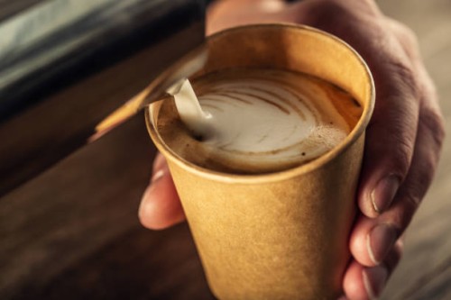 barista pouring milk in cappuccino coffee in coffeeshop. - junk food stock pictures, royalty-free photos & images