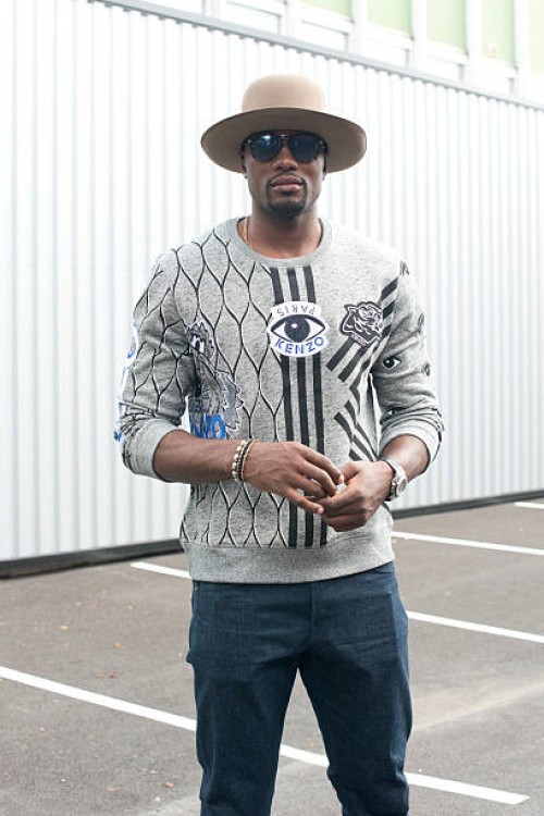 Basketball player Serge Ibaka wears Kenzo jumper and Prada sunglasses on day 4 of Paris Fashion Week Menswear Spring/Summer 2016 on June 25, 2015 in...