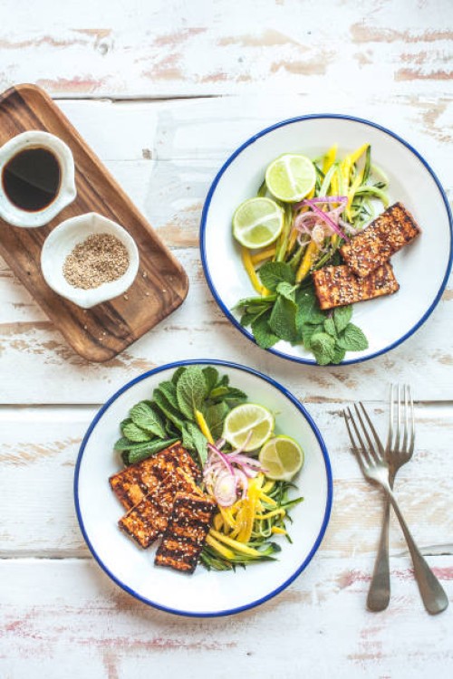 bbq tofu cutlets with mango salad for two - food stock pictures, royalty-free photos & images