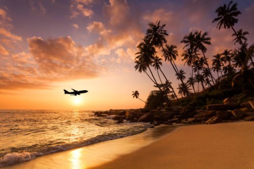 beach at sunset and a flying plane. summer vacation on tropical resort - travel stock pictures, royalty-free photos & images