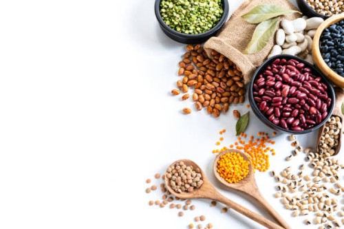 beans variation shot from above on white background with copy space - food stock pictures, royalty-free photos & images