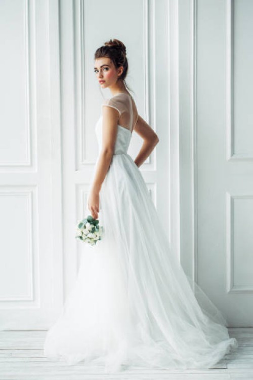 beautiful brunette woman as bride with wedding bouquet - fashion stock pictures, royalty-free photos & images
