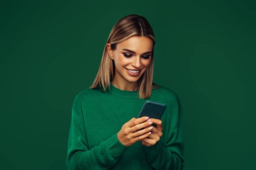 beautiful emotional woman holding smart phone - fashion stock pictures, royalty-free photos & images