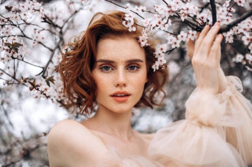 beautiful girl on the background of spring bush - fashion stock pictures, royalty-free photos & images