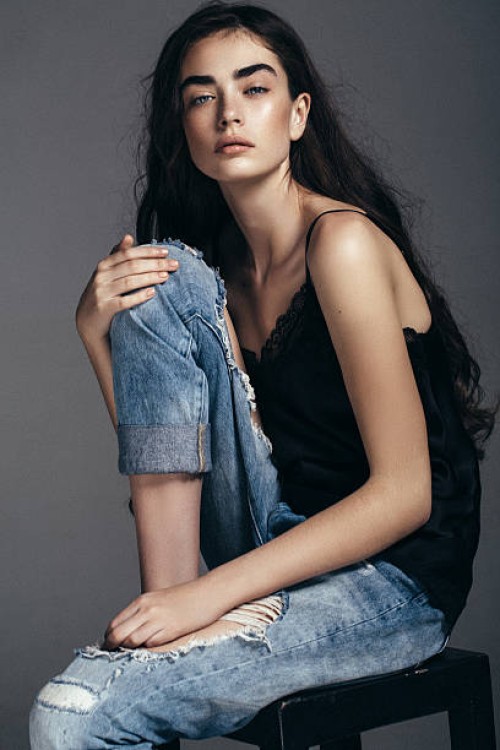 beautiful girl sitting at the studio - fashion stock pictures, royalty-free photos & images