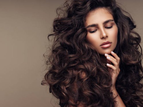 beautiful girl with lush curly hairstyle - hairstyle stock pictures, royalty-free photos & images