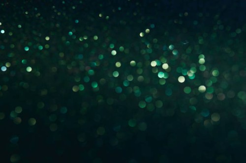 beautiful green holiday background with glitter and blurred and focal lights for new year, christmas or birthday. - fashion photos et images de collection