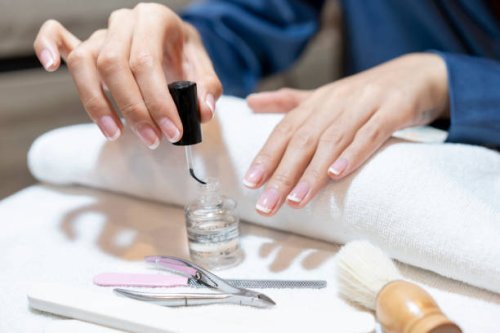 beautiful manicured woman's nails with cream nail - nails art stock pictures, royalty-free photos & images