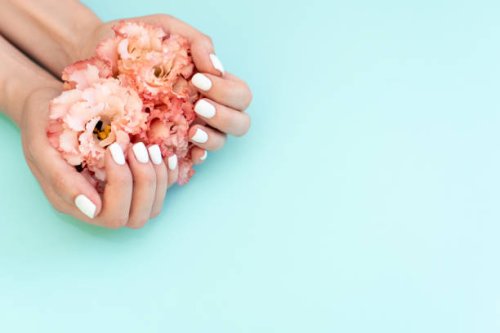 beautiful stylish female manicure. tulip flower. pink background. - nails art stock pictures, royalty-free photos & images