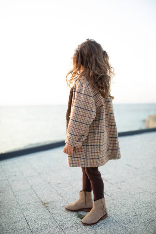 beautiful toddler girl with long hair in wool blazer posing outdoor. - fashion stock pictures, royalty-free photos & images
