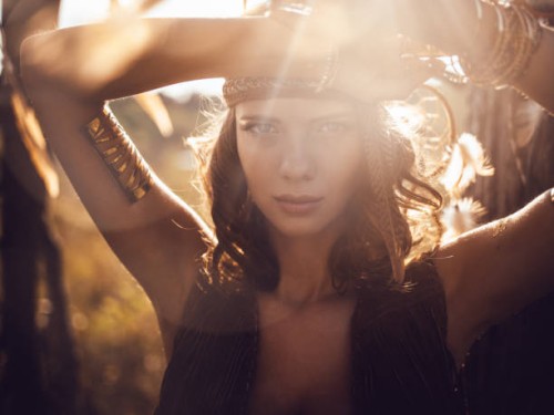 beautiful wild girl portrait in golden sun flare - fashion stock pictures, royalty-free photos & images