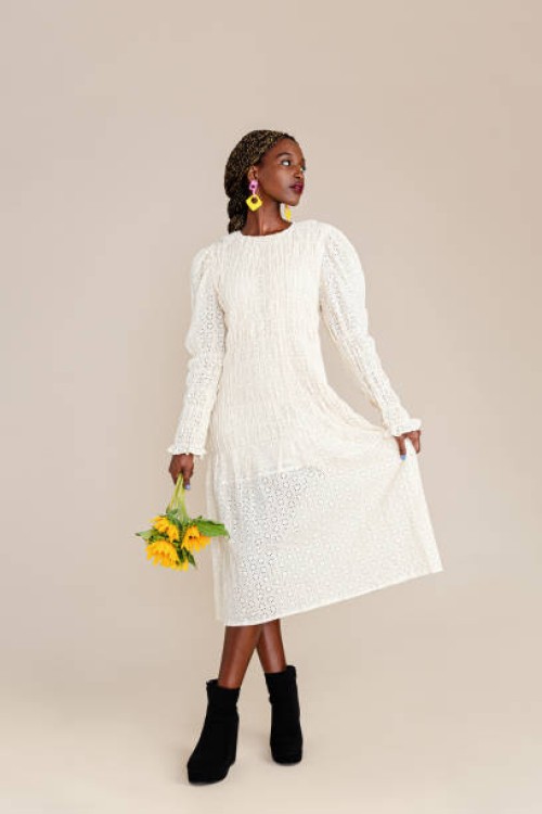 beautiful woman holding sunflowers - fashion stock pictures, royalty-free photos & images