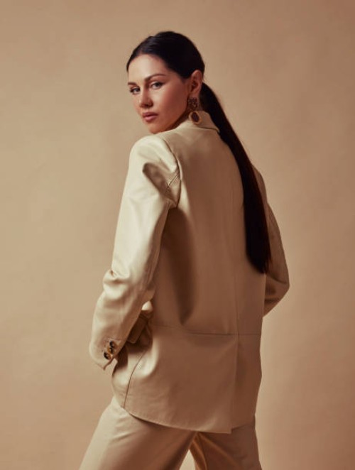 beautiful woman in a leather suit, looking masculine. - fashion stock pictures, royalty-free photos & images