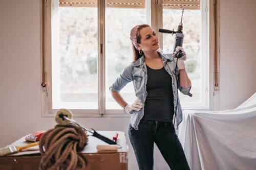 beautiful woman redecorating her home - home decoration stock pictures, royalty-free photos & images