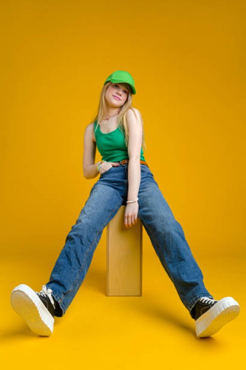 beautiful woman wearing jeans and tank top - fashion stock pictures, royalty-free photos & images